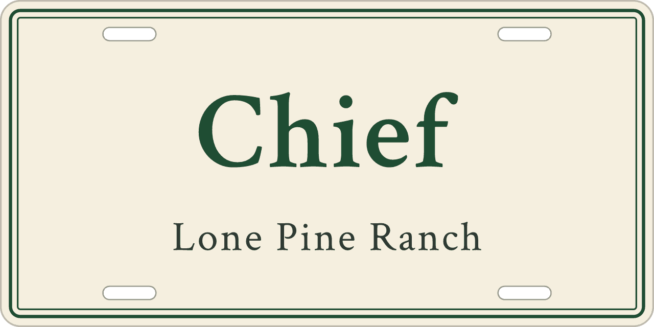 Cream and forest green: a stall sign reading Chief, Lone Pine Ranch