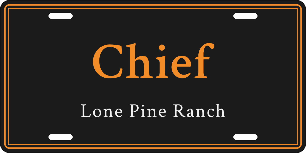 Black and orange: a stall sign reading Chief, Lone Pine Ranch